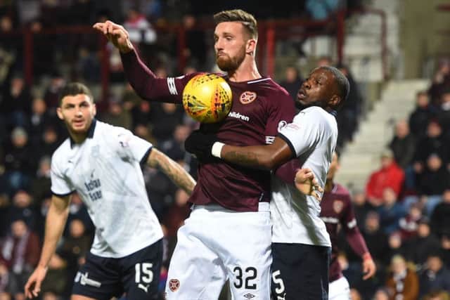 Hearts striker David Vanecek competes with Genseric Kusunga on Wednesday. Picture: SNS