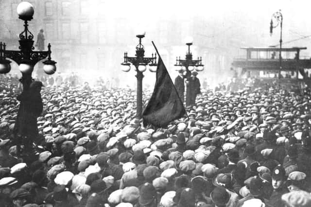 The Red Flag is raised in George Square in Glasgow in 1919.