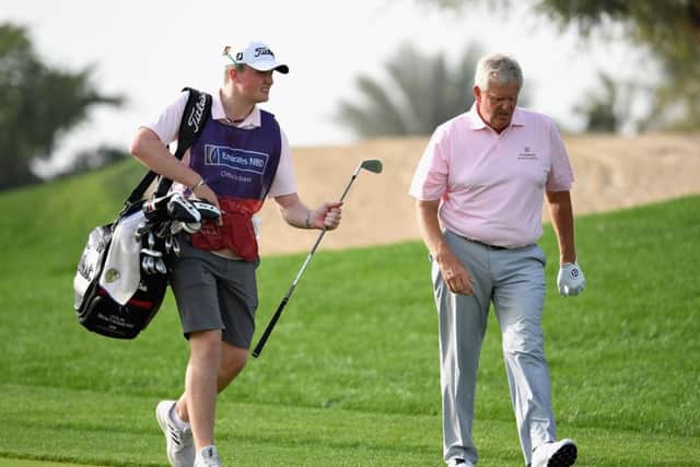 Colin Montgomerie, who had son Cameron on the bag, missed the cut in an event he won in 1996. Picture: Ross Kinnaird/Getty Images