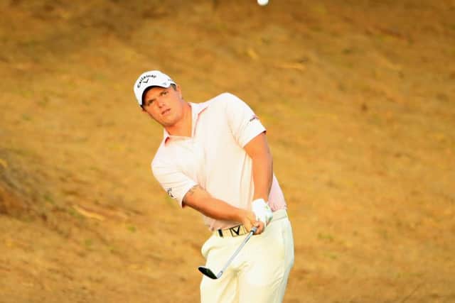 Callum Shinkwin plays his third shot on the third during day two of the Omega Dubai Desert Classic. Picture: Andrew Redington/Getty