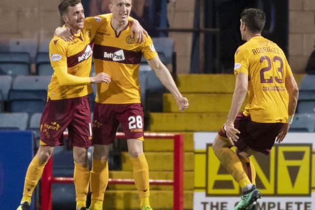 Motherwell's David Turnbull (C) celebrates putting his side ahead from the penalty spot. Pic: SNS/Paul Devlin