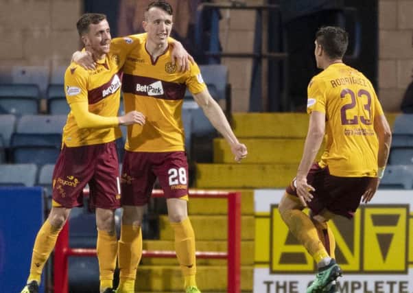 Motherwell's David Turnbull (C) celebrates putting his side ahead from the penalty spot. Pic: SNS/Paul Devlin