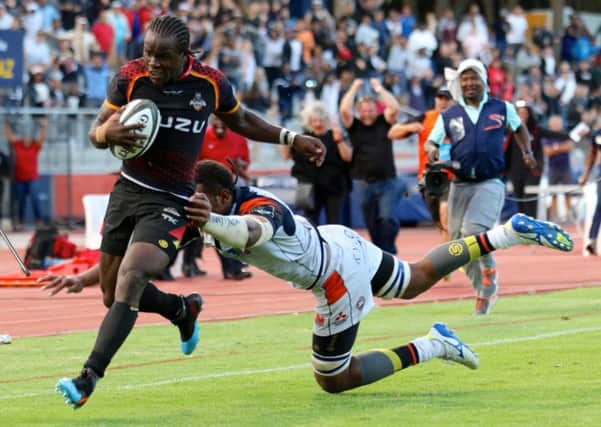Edinburgh's Viliame Mata can't get to grips with Yaw Penxe as the South African runs through to score the Kings' final try in Port Elizabeth. Picture: Richard Huggard/INPHO/REX/Shutterstock