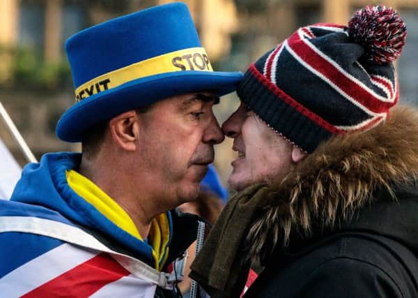 Anti-Brexit protester Steve Bray and a pro-Brexit protester argue as they demonstrate outside the Houses of Parliament in Westminster on January 08, 2019 in London, England. (Photo by Jack Taylor/Getty Images)