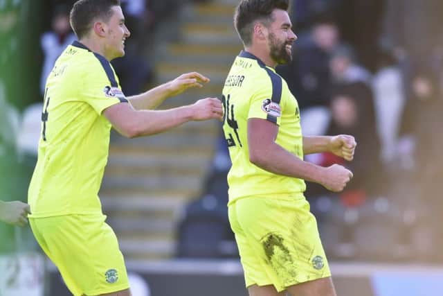 Darren McGregor, right, celebrates scoring Hibs' second, and decisive, goal in their 3-1 victory over St Mirren. Picture: SNS.