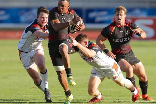 Edinburghs Chris Dean and George Taylor try to get to grips with Harlon Klaasen of Southern Kings at NMU Stadium in Port Elizabeth on Saturday. Picture: Rex/Shutterstock