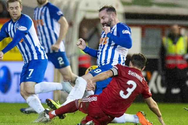 Kris Boyd was sent off for this challenge on Graeme Shinnie. Picture: SNS