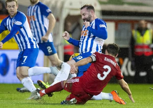 Kris Boyd was sent off for this challenge on Graeme Shinnie. Picture: SNS