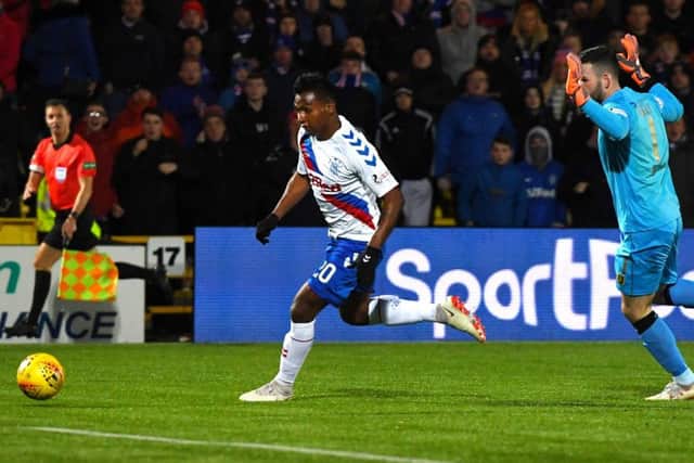 Alfredo Morelos rounds Livingston goalkeeper Liam Kelly to seal Rangers' 3-0 victory. Picture: SNS.