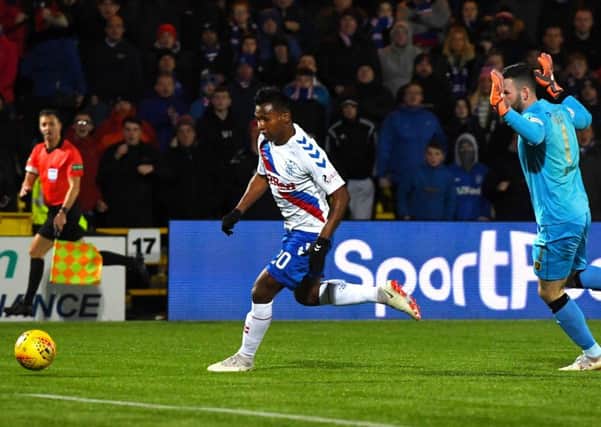 Alfredo Morelos rounds Livingston goalkeeper Liam Kelly to seal Rangers' 3-0 victory. Picture: SNS.