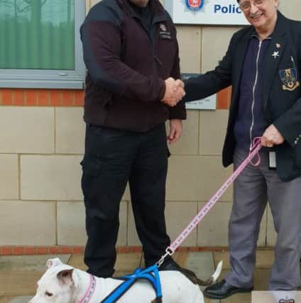 PC Martyn Tulk (left) with Adrian Gleadhill and his dog Nala after he was reunited the stolen dog after four years apart. Picture: Kent Police/PA Wire