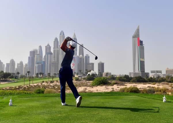 Bryson Dechambeau drives during the Omega Dubai Desert Classic. Picture: Giuseppe Cacace/AFP/Getty