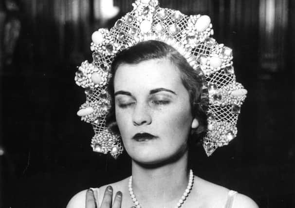 1930:  The Duchess of Argyll at a dress rehearsal for the Jewels of Empire Ball at Brook House in Park Lane.  (Photo by Central Press/Getty Images)