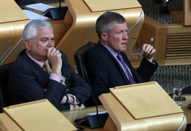 Scottish Liberal Democrat leader Willie Rennie(r) and Liberal Democrat MSP Mike Rumbles during FMQs. Picture: Andrew Milligan/PA Wire