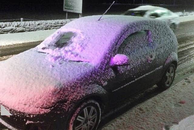 The car's rear and side windows were completely caked in snow. Picture: Police Scotland