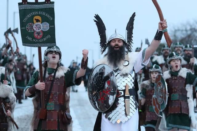 Guizer Jarl John Nicolson and his squad march through Lerwick as snow falls on the Shetland Isles during the Up Helly Aa Viking festival. Picture: Andrew Milligan/PA Wire