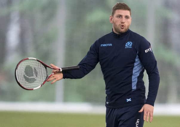 Scotland stand-off Finn Russell twirls a tennis racket after a knockabout during a training session at Oriam. Picture: Paul Devlin/SNS/SRU