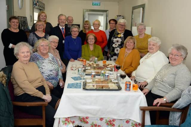 Staff and residents of Woodlands Grove in Viewpark are joined by Councillor Bob Burrows and Provost Jean Jones, who officially opened the new common room