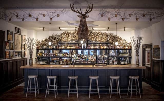 The Flying Stag public bar in The Fife Arms, where a stage leaps out over the bar and paintings of local characters decorate the walls. Picture: Sim Canetty-Clarke