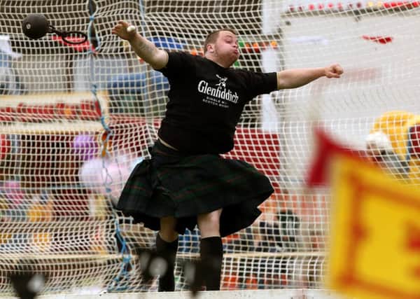 A competitor throws the weight at the Ballater Highland Games.