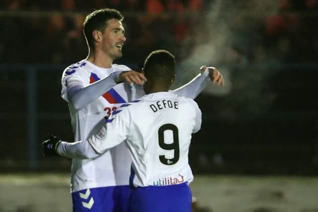 Rangers striker Kyle Lafferty celebrates with Jermain Defoe after scoring his sides third goal. Picture: Jane Barlow/PA