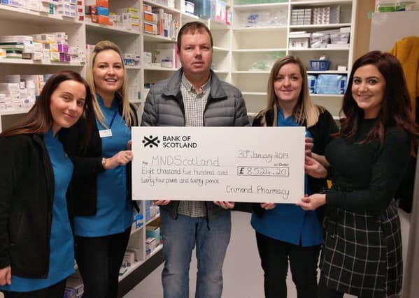Vicki Buchan, Erica Niven, Lauren Duncan and Lindsay Duthie present the cheque to Doug Hastie who accepted the donation on behalf of MND Scotland