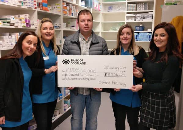Vicki Buchan, Erica Niven, Lauren Duncan and Lindsay Duthie present the cheque to Doug Hastie who accepted the donation on behalf of MND Scotland