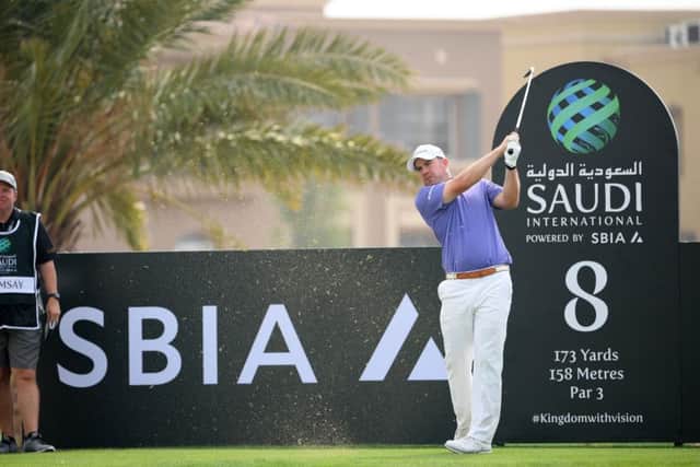 Scotland's Richie Ramsay plays off the eighth tee during the first dayof the Saudi International  Picture: Ross Kinnaird/Getty Images