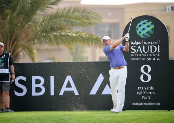 Scotland's Richie Ramsay plays off the eighth tee during the first dayof the Saudi International  Picture: Ross Kinnaird/Getty Images
