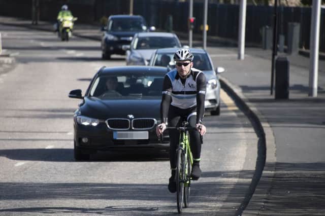 Drivers passing cyclists too close are among the risks they face. Picture: Andrew O'Brien
