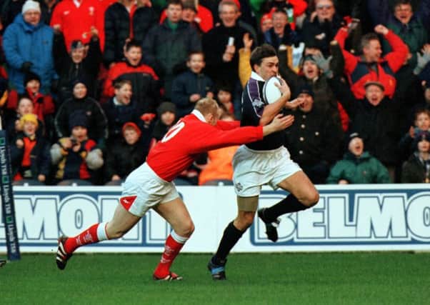 John Leslie breaks clear to score Scotland's opening try after only 10 seconds in the 33- 20
 victory over Wales in the Five Nations at Murrayfield in 1999.