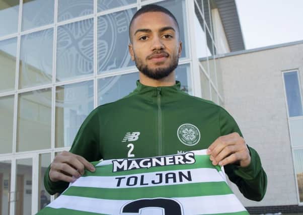 New signing Jeremy Toljan with his new Celtic jersey.