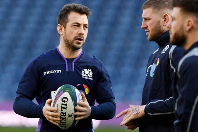 Scotland skipper Greig Laidlaw chats to stand-off Finn Russell during the captain's run at Murrayfield. Picture: Alan Harvey/SNS/SRU