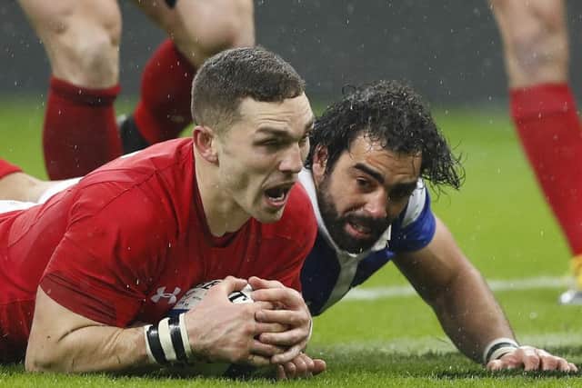 George North scores Wales second try after a mistake by Yoann Huget, right. Picture: Christophe Ena/AP