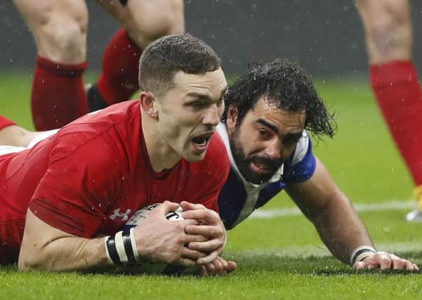 George North scores Wales second try after a mistake by Yoann Huget, right. Picture: Christophe Ena/AP