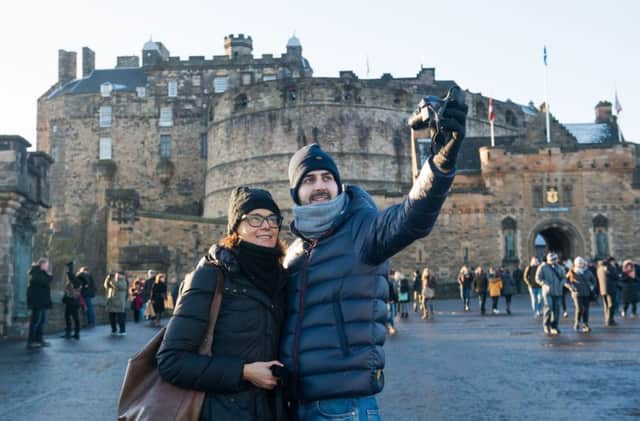 Visitors at Edinburgh Castle, who may soon face a £2 hotel levy. Picture: Ian Georgeson