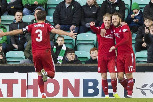 Gary Mackay-Steven (centre) celebrates his goal with Stevie May (R) and Graeme Shinnie. Pic: SNS/Paul Devlin