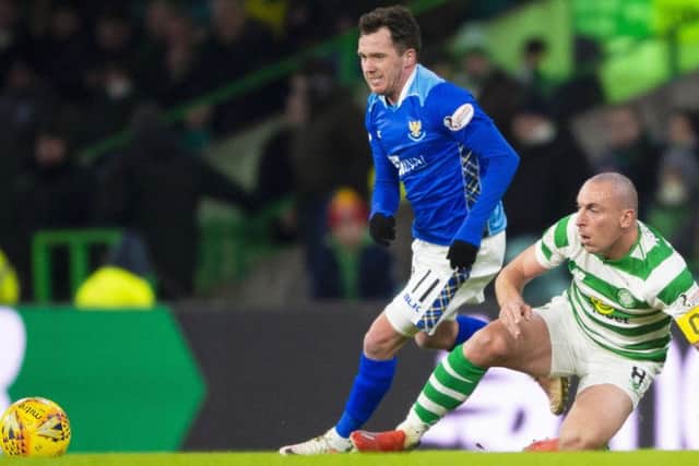 St Johnstone's Danny Swanson competes with Celtic's Scott Brown. Pic: SNS/Rob Casey