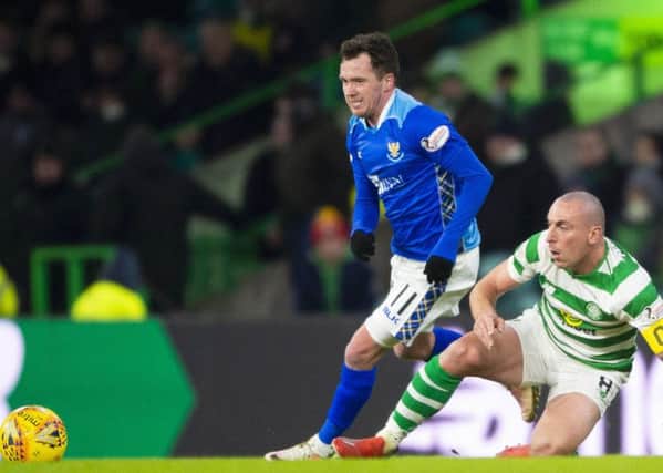 St Johnstone's Danny Swanson competes with Celtic's Scott Brown. Pic: SNS/Rob Casey