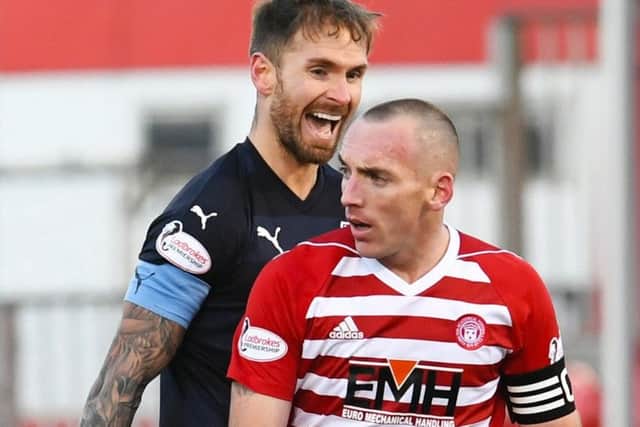 Dundee's Martin Woods (left) and Darian MacKinnon.
