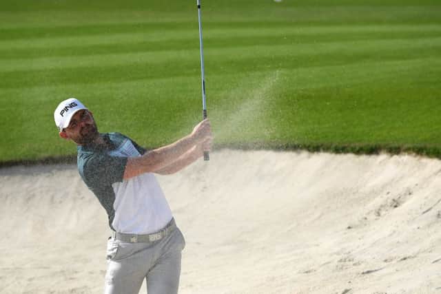 Liam Johnston splashes out of a bunker at Royal Greens in King Abdullah Economic City on his way to a level-par 70. Picture: Ross Kinnaird/Getty Images