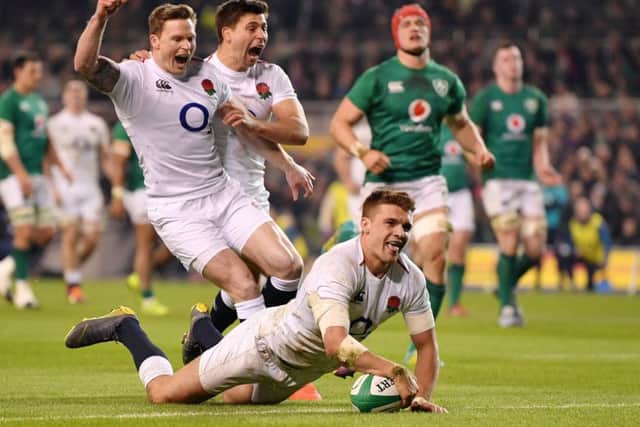 Henry Slade touches down in the second half to seal Englands victory. Below, Owen Farrell was on target with the boot. Photograph: Getty Images