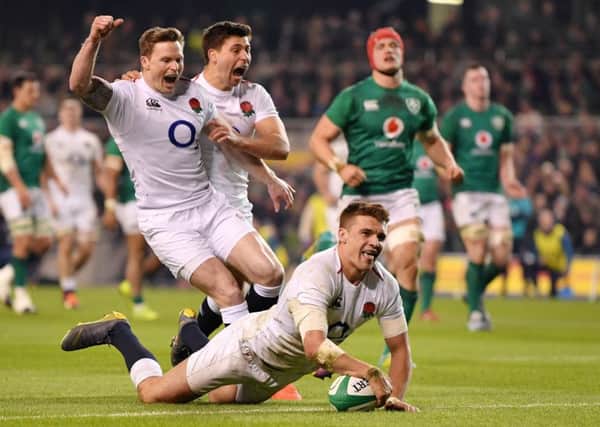Henry Slade touches down in the second half to seal Englands victory. Below, Owen Farrell was on target with the boot. Photograph: Getty Images