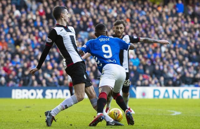 Rangers' Jermain Defoe goes down under a challenge and earns his side their second penalty of the afternoon. Picture: SNS