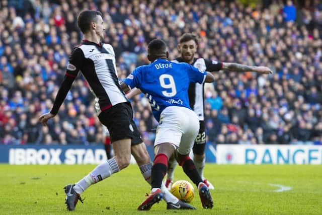 Rangers' Jermain Defoe goes down under a challenge and earns his side their second penalty of the afternoon. Picture: SNS