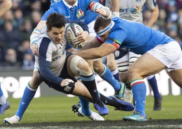 Sam Johnson tries to cling on to the ball under pressure from Italys Andrea Lovotti. Picture: SNS/SRU.