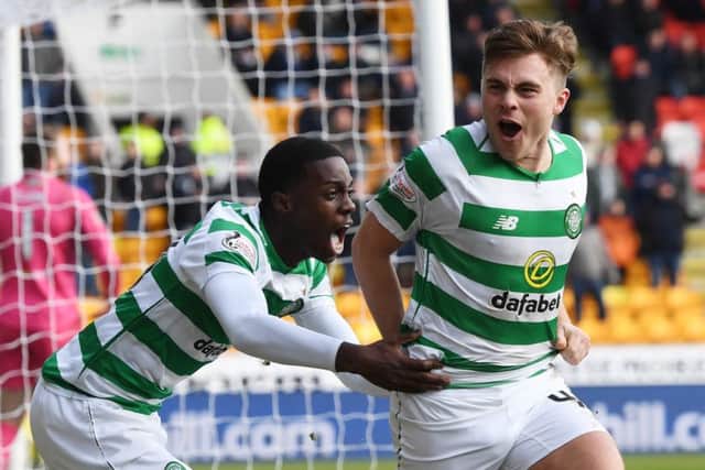 James Forrest, right, celebrates his opening goal with Timothy Weah, who provided the assist. Picture: SNS