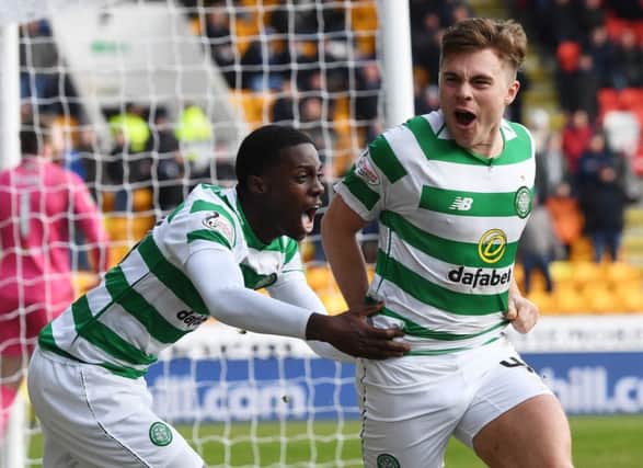 James Forrest, right, celebrates his opening goal with Timothy Weah, who provided the assist. Picture: SNS