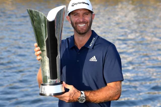 Dustin Johnson celebrates with the trophy after winning the Saudi International at the Royal Greens Golf & Country Club. Picture: Getty