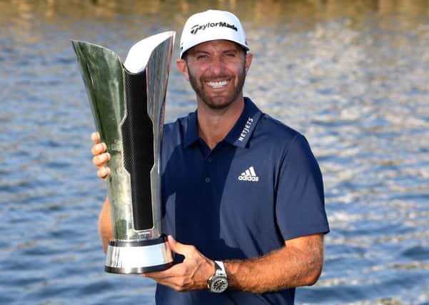 Dustin Johnson celebrates with the trophy after winning the Saudi International at the Royal Greens Golf & Country Club. Picture: Getty